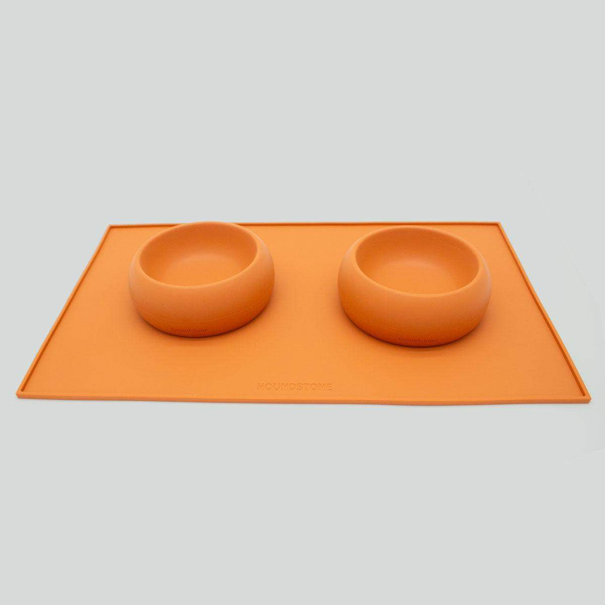 Houndstone silicone dog food mat in marigold with dog bowls