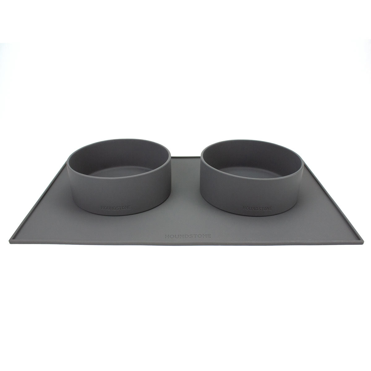 two silicone dog food bowls on top of a houndstone dog bowl mat charcoal