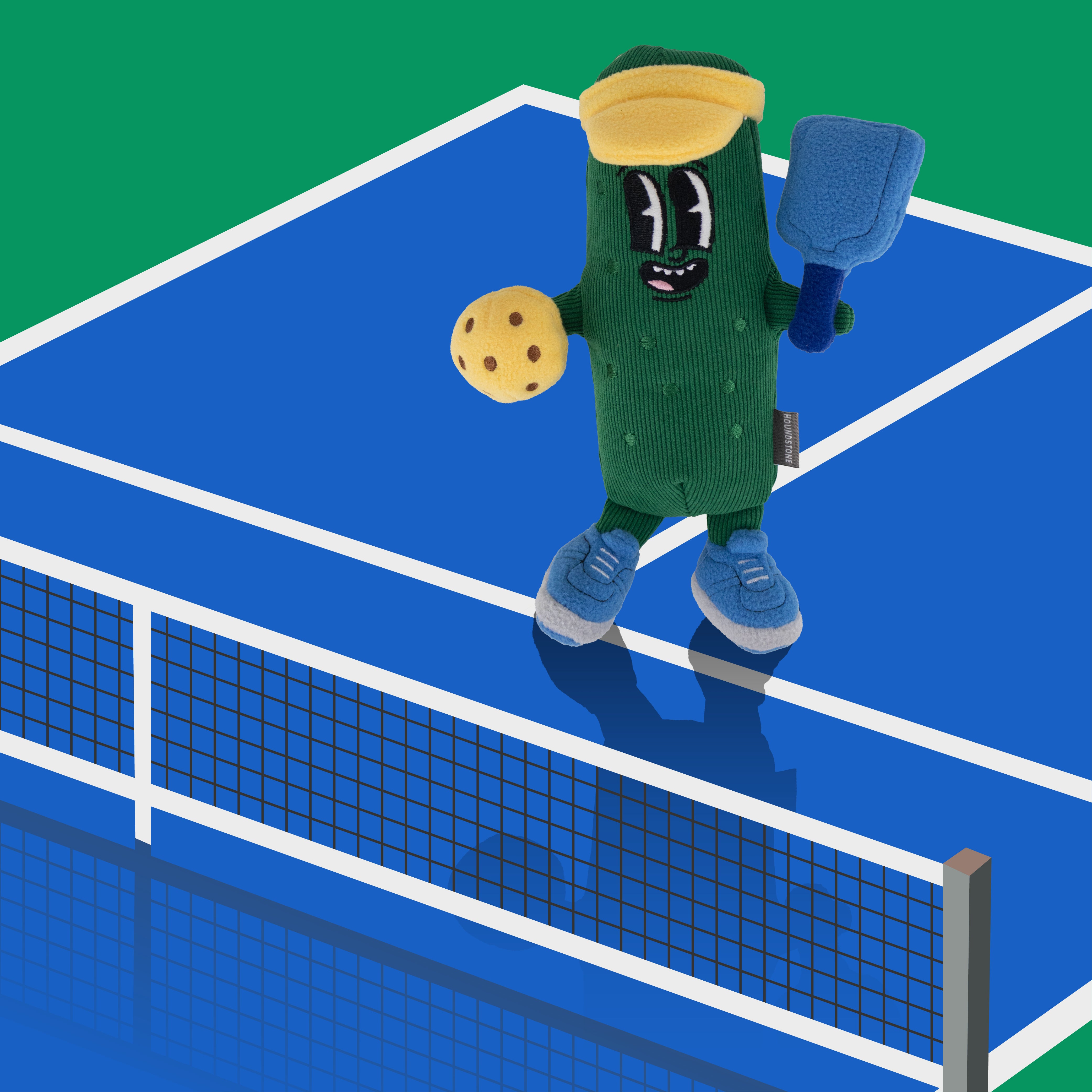 Houndstone pickleball champ plush Dog toy, dog toy with squeaker and crinkle paper on a blue pickleball court