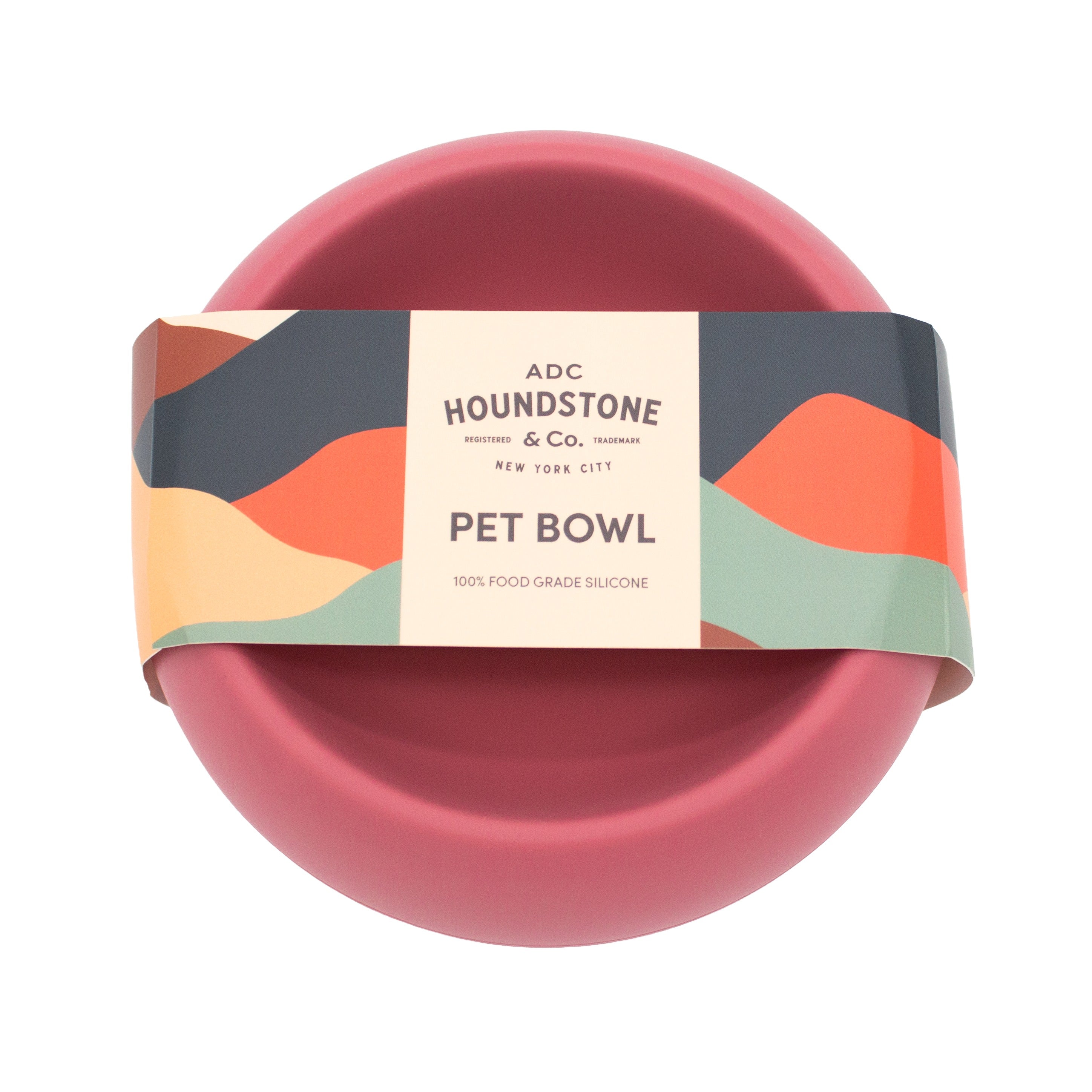 Top view of houndstone coquito silicone dog food bowl in rosewood color with packaging