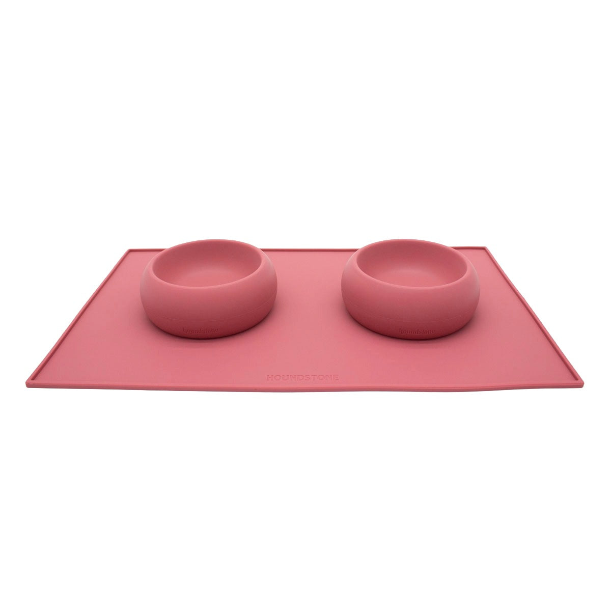 two houndstone coquito silicone dog food bowls in rosewood color on a rosewood dog food mat
