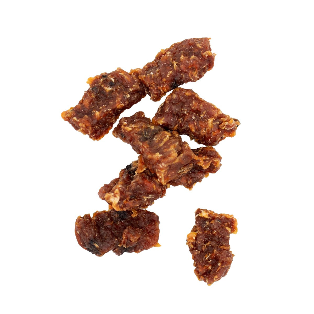 Several small pieces of textured, crunchy dehydrated dog treats arranged on a plain white background.