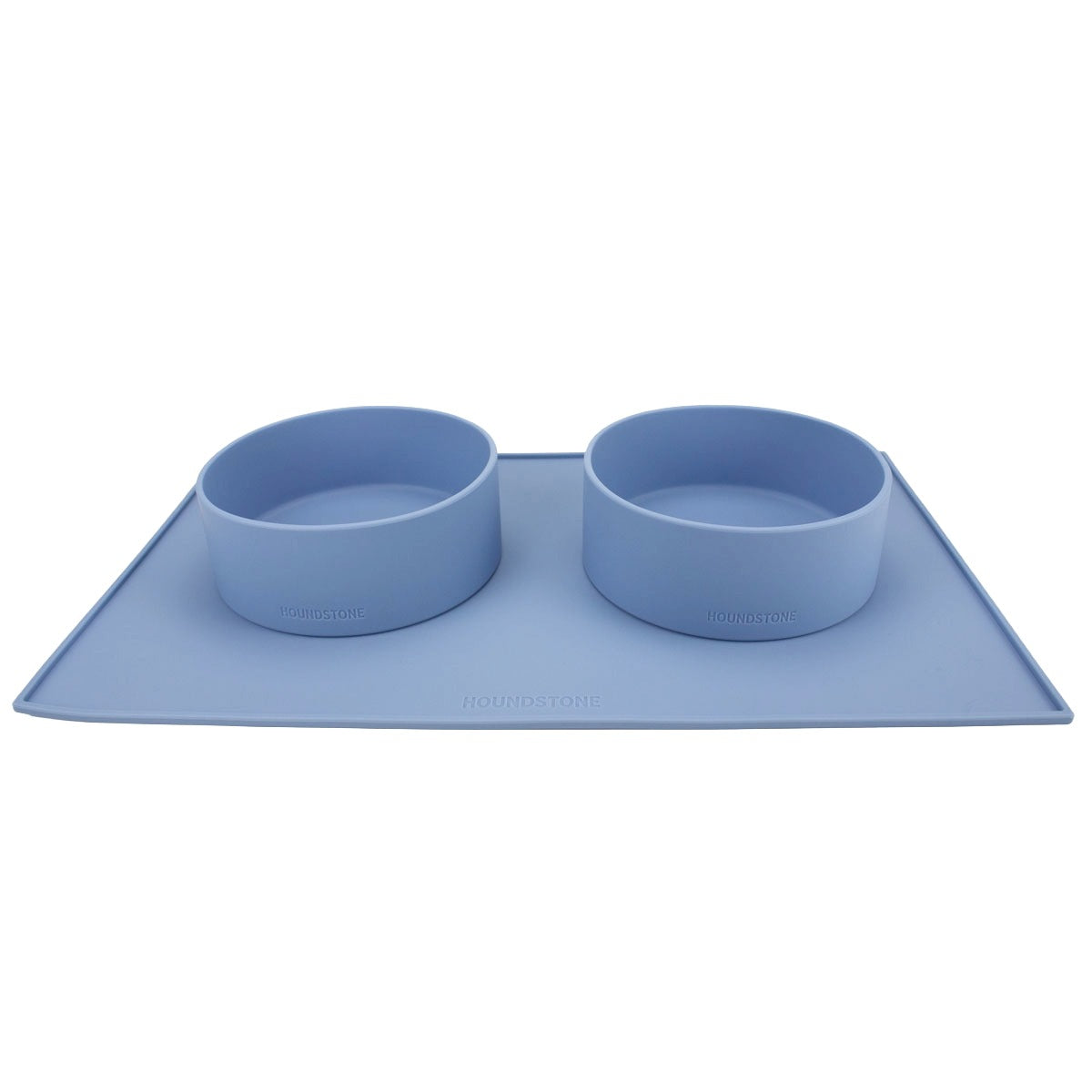 two houndstone pony silicone dog bowls in blue on a dog food mat
