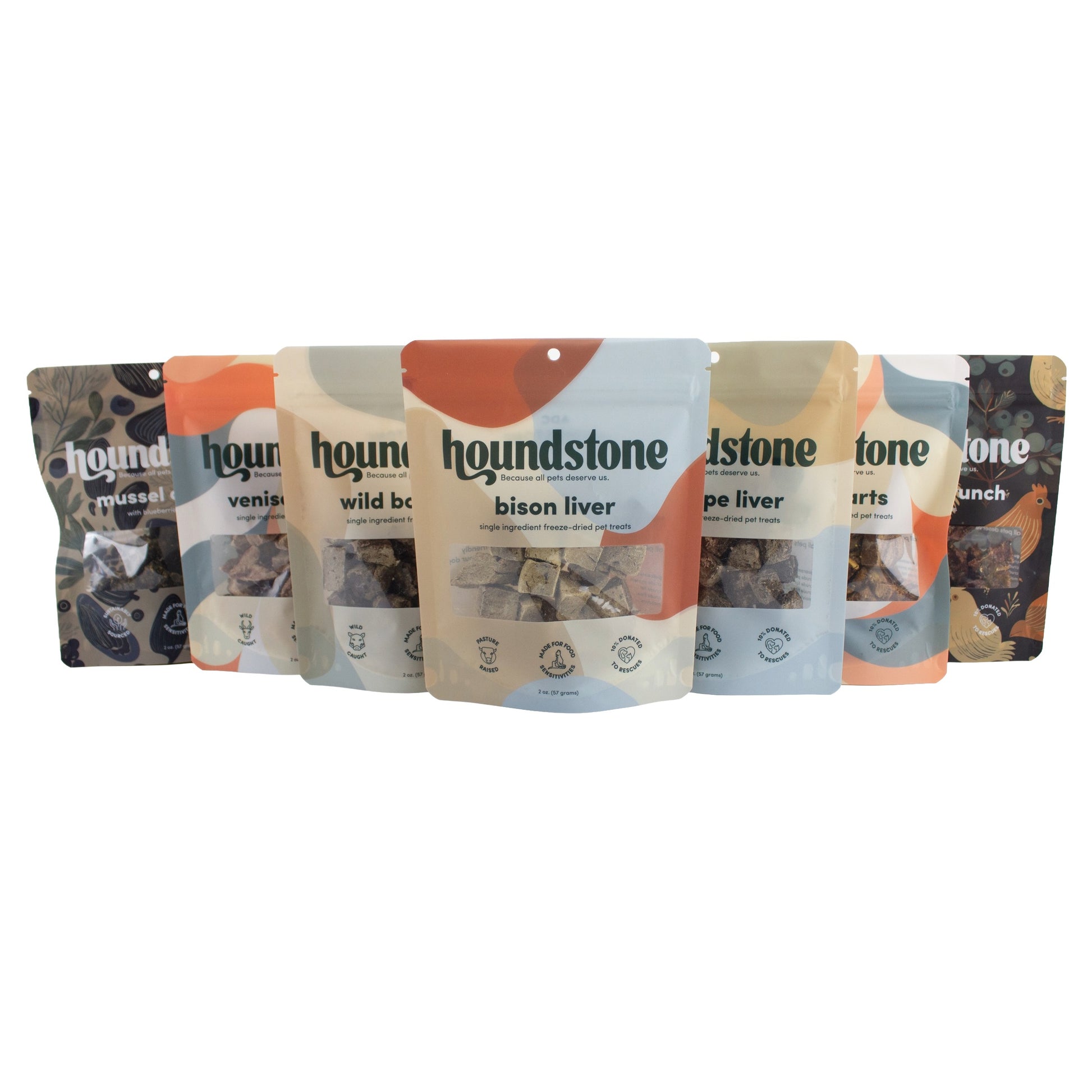 7 pouches of houndstone freeze dried cat treats and dehydrated cat treats, on a white background