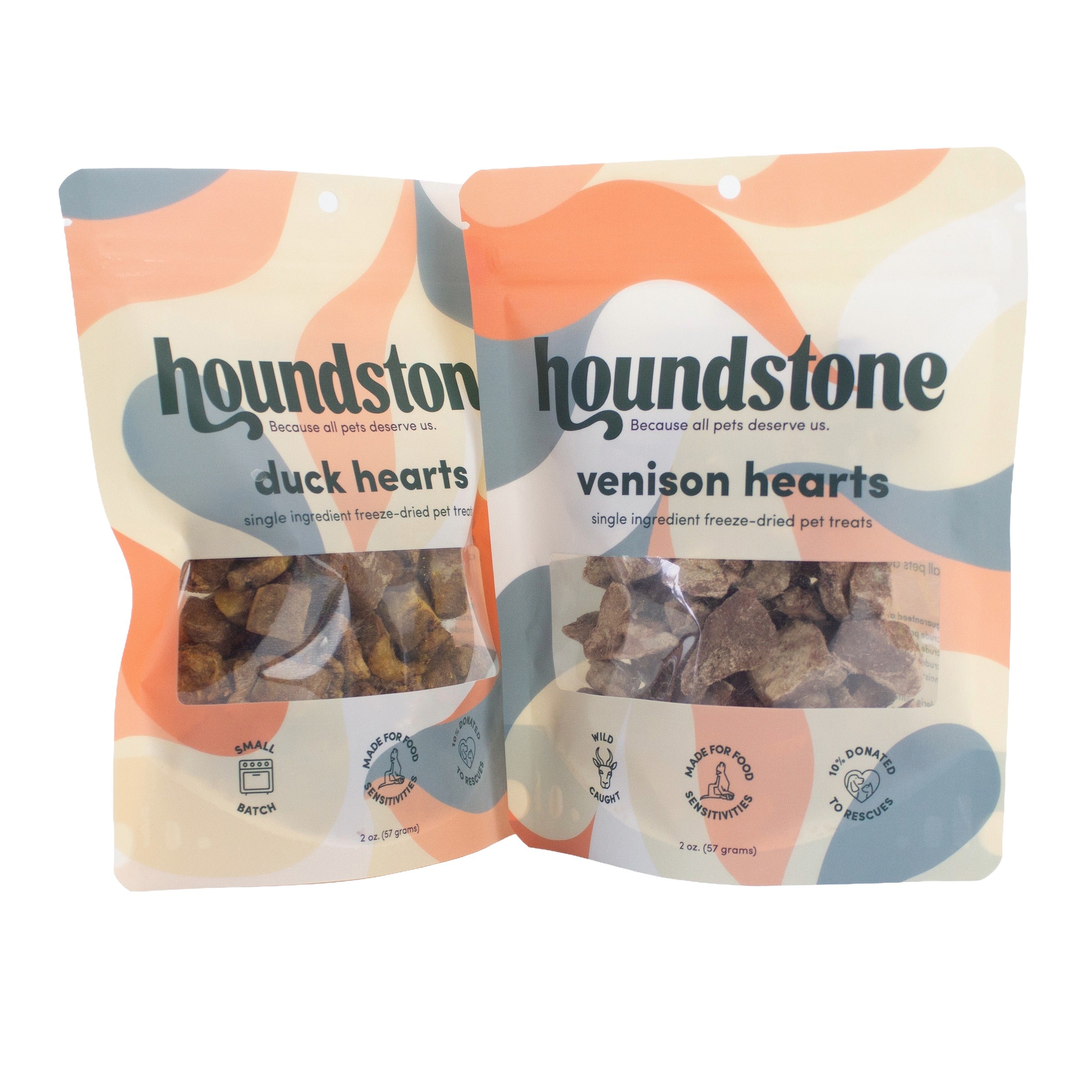 Two stand-up pouches of Houndstone freeze dried dog treats on a white background. The left pouch is labeled duck hearts, and the right pouch is labeled venison hearts dog treats