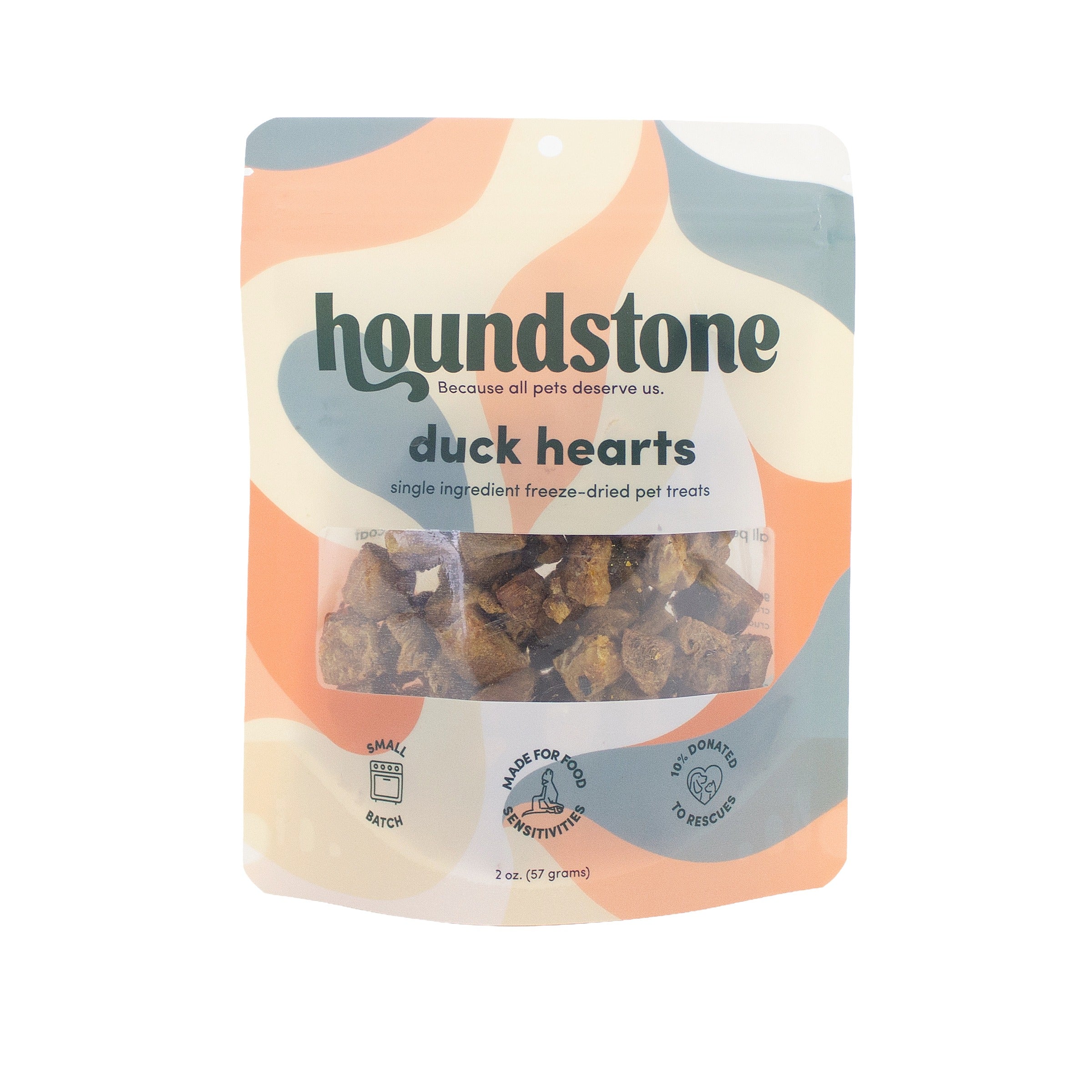 A 2 oz pouch of Houndstone Duck Hearts freeze-dried dog treats, featuring a retro wavy pattern in orange, beige, and blue-gray, with a clear window showing the dog treats inside.