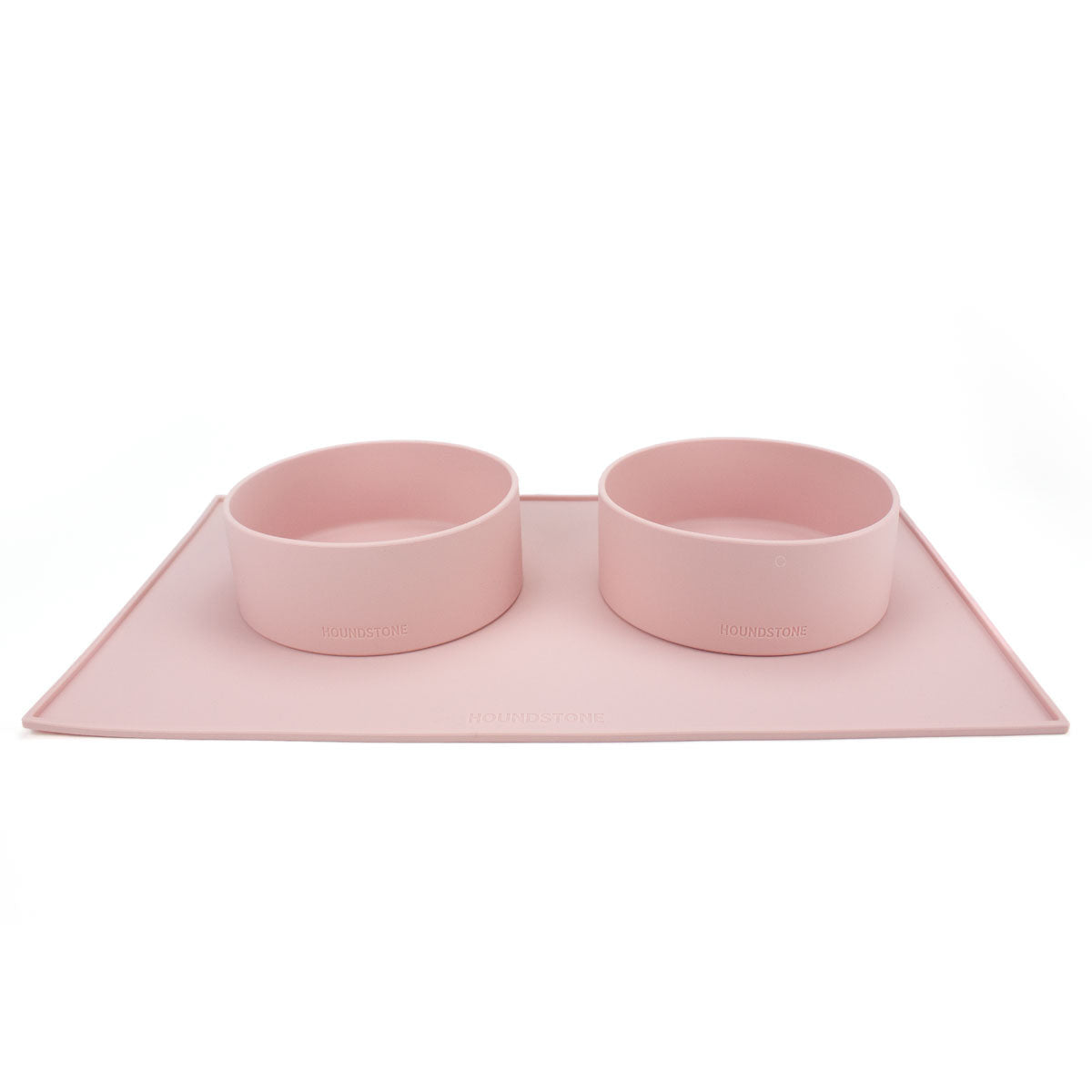 Houndstone silicone dog bowl mat in pink with 2 silicone dog food bowls on top 