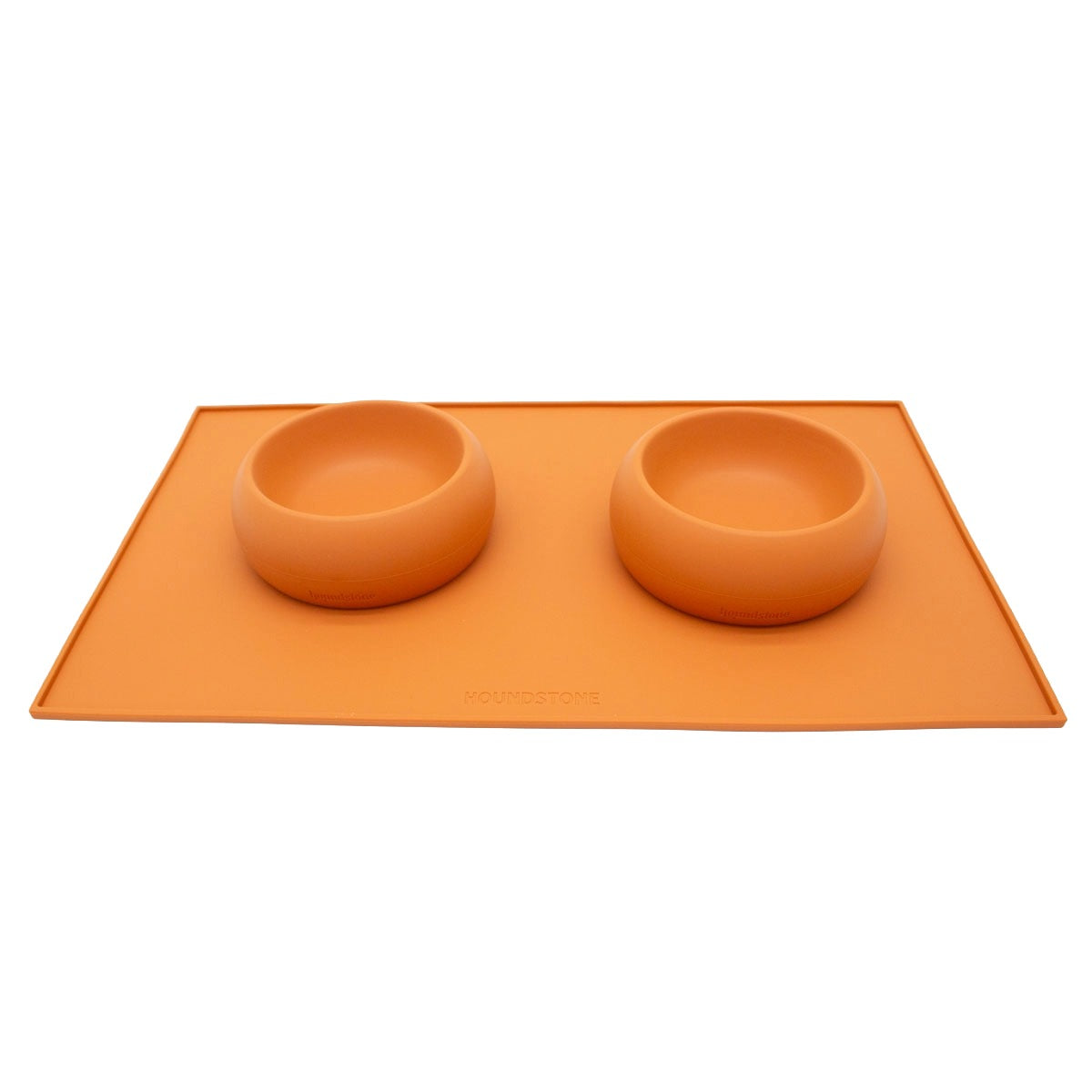 houndstone silicone dog bowl mat in marigold with two coquito silicone dog bowls on it