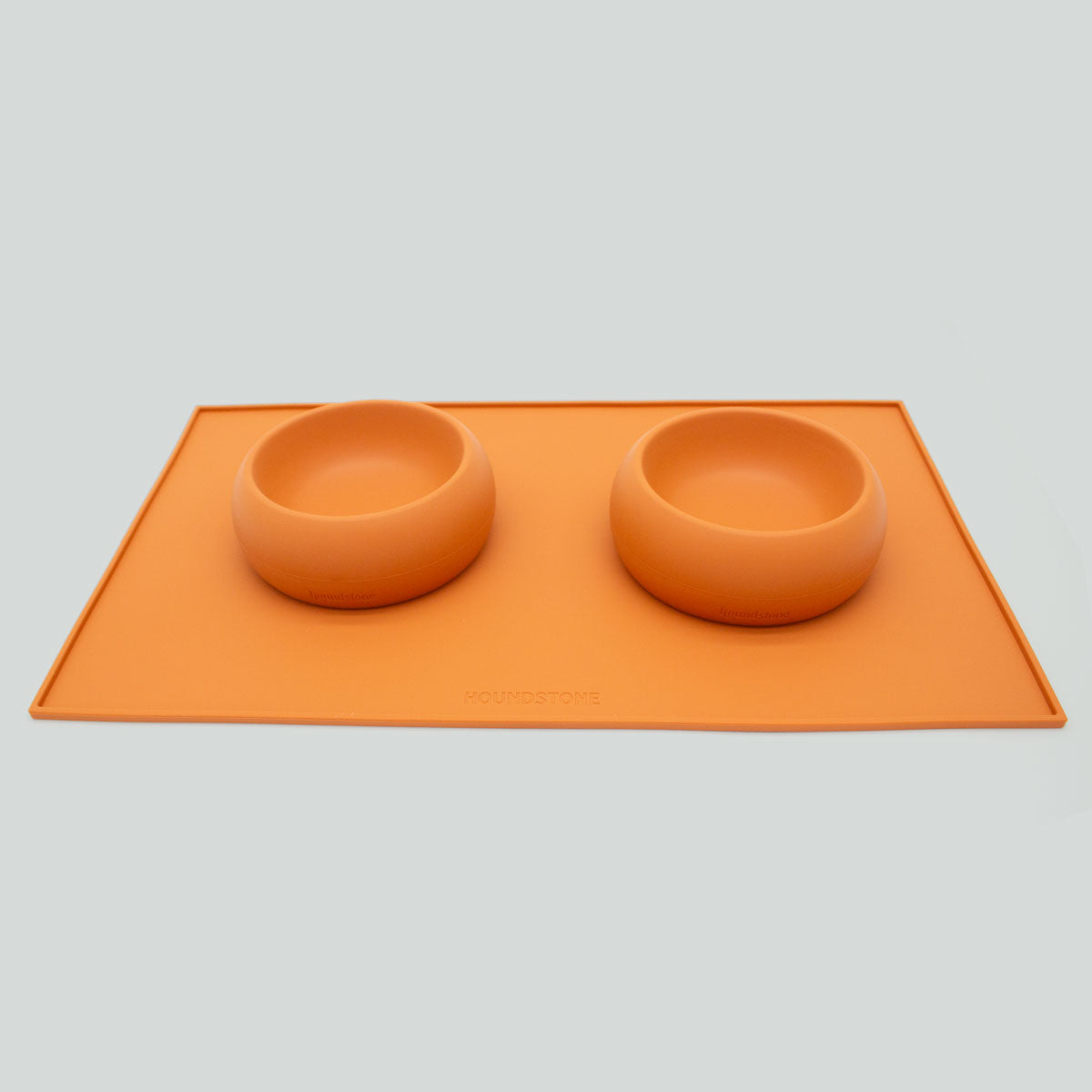 houndstone silicone pet food mat in marigold with bowls